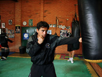 Coach Istvan Solyom on the heavy bag